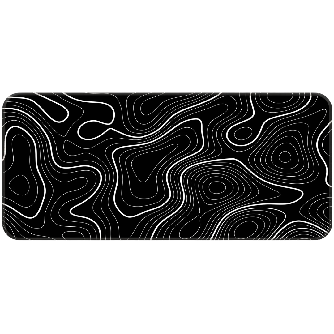 Black and white topographic desk mat on developer desk setup with mechanical keyboard.